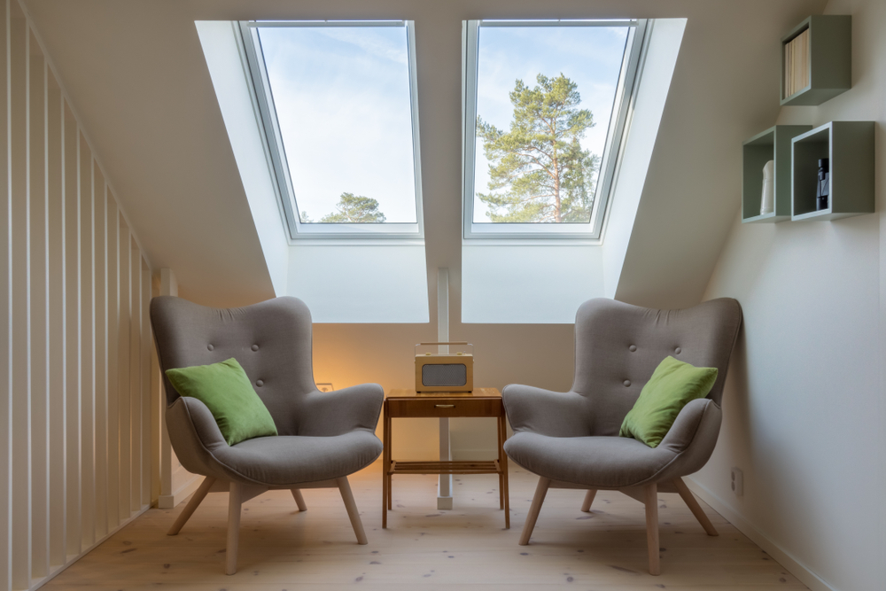 Two skylights with two chairs & table, sitting nook