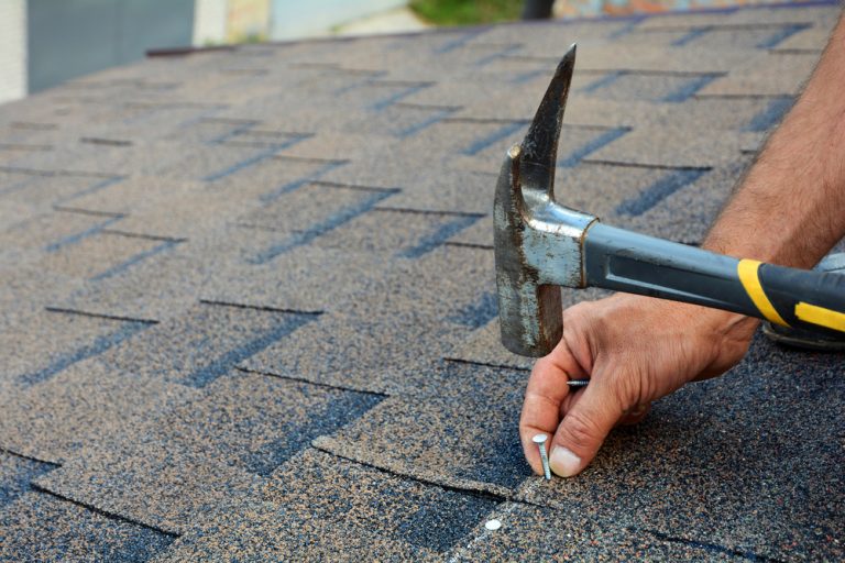 Roof maintenance, nailing screws into shingles