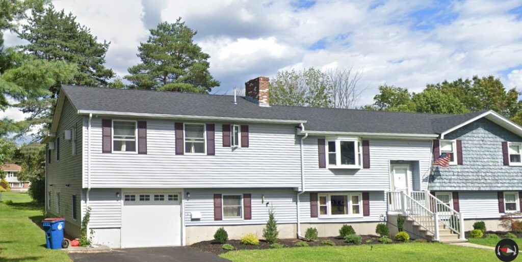 A home with white siding in Burlington, MA