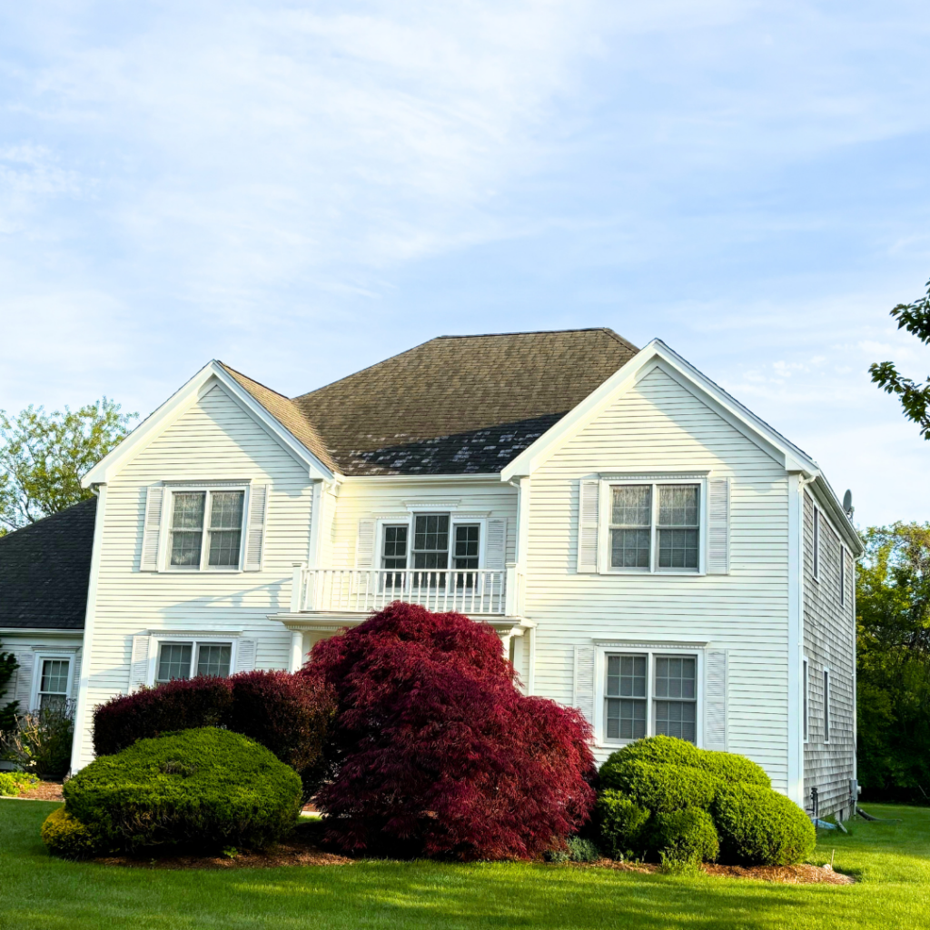 A home in Sagamore beach that has its roofing and siding damaged
